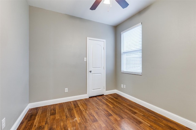 7418 Novella Dr, Fort Worth, TX 76134 - unfurnished room featuring a ceiling fan, dark wood finished floors, and baseboards