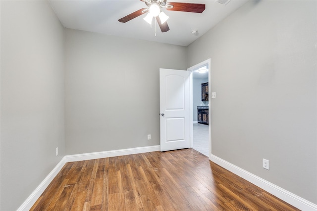 7418 Novella Dr, Fort Worth, TX 76134 - spare room with a ceiling fan, wood finished floors, baseboards, and a smoke detector