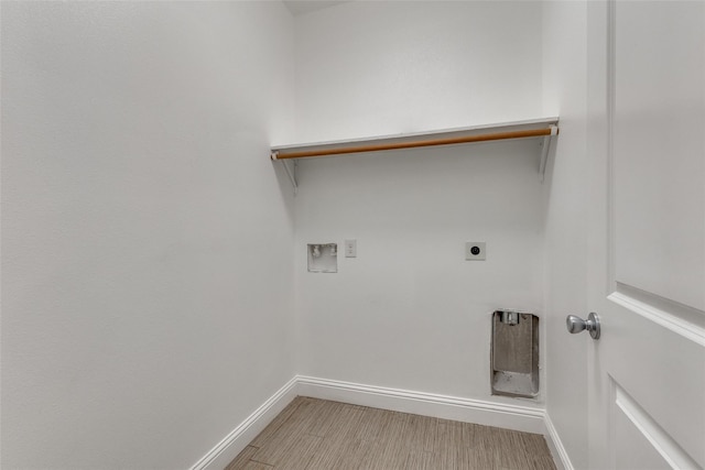 7418 Novella Dr, Fort Worth, TX 76134 - laundry room featuring baseboards, hookup for an electric dryer, hookup for a washing machine, and light wood-style flooring