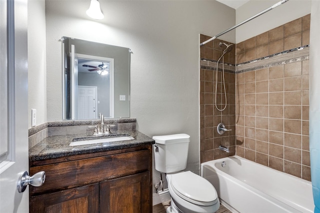7418 Novella Dr, Fort Worth, TX 76134 - full bath featuring toilet, a ceiling fan,  shower combination, vanity, and a textured wall