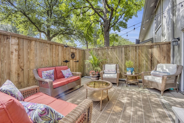 view of patio / terrace featuring an outdoor hangout area and a fenced backyard