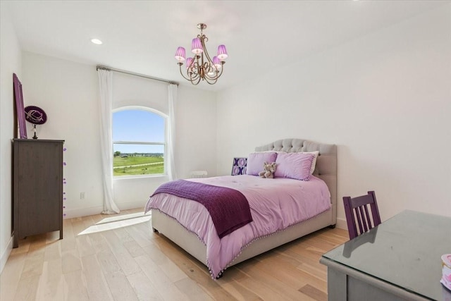 477 Willow Moon Ranch Rd, Crawford, TX 76638 - bedroom featuring a chandelier, light wood-type flooring, recessed lighting, and baseboards