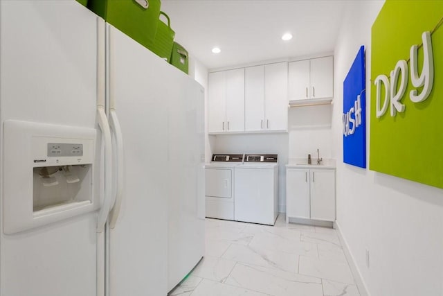 477 Willow Moon Ranch Rd, Crawford, TX 76638 - washroom featuring washer and clothes dryer, light marble finish floors, recessed lighting, cabinet space, and baseboards
