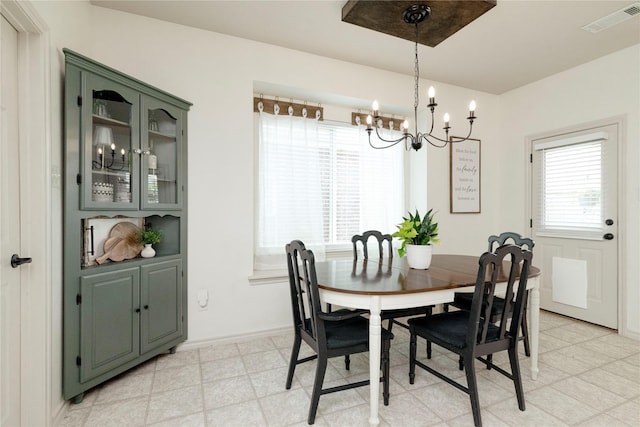 10617 Big Oak Dr, Fort Worth, TX 76131 - dining area featuring a chandelier, baseboards, and light floors