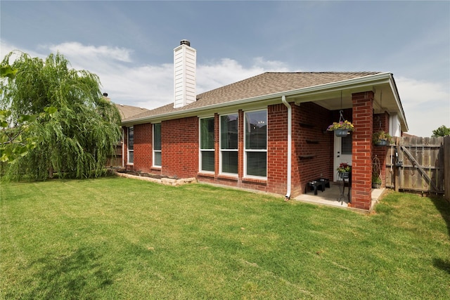 10617 Big Oak Dr, Fort Worth, TX 76131 - back of house with brick siding, a patio, a chimney, and a shingled roof