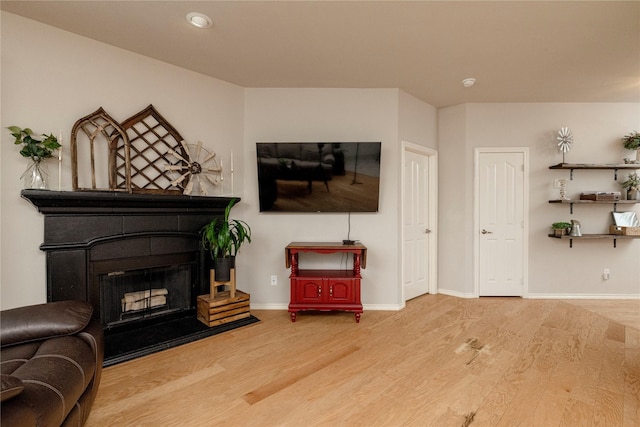 10617 Big Oak Dr, Fort Worth, TX 76131 - living room featuring wood finished floors, a fireplace with flush hearth, and baseboards