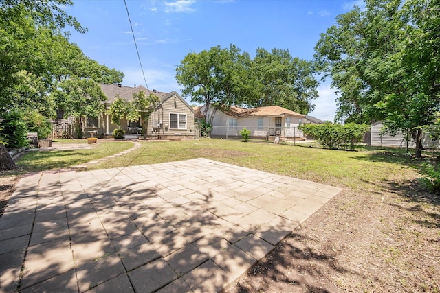 rear view of property with a patio area, an outbuilding, and a shed