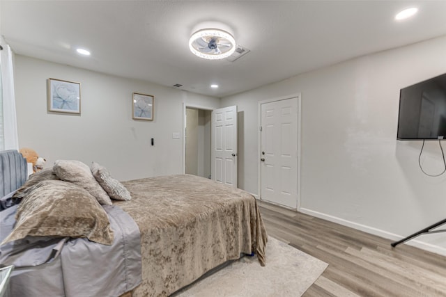 3444 Kellogg Ave, Dallas, TX 75216 - bedroom with wood finished floors, baseboards, and recessed lighting