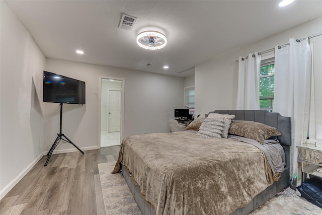 3444 Kellogg Ave, Dallas, TX 75216 - bedroom featuring wood finished floors, recessed lighting, and baseboards