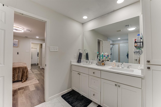 3444 Kellogg Ave, Dallas, TX 75216 - ensuite bathroom with a stall shower, double vanity, baseboards, and recessed lighting