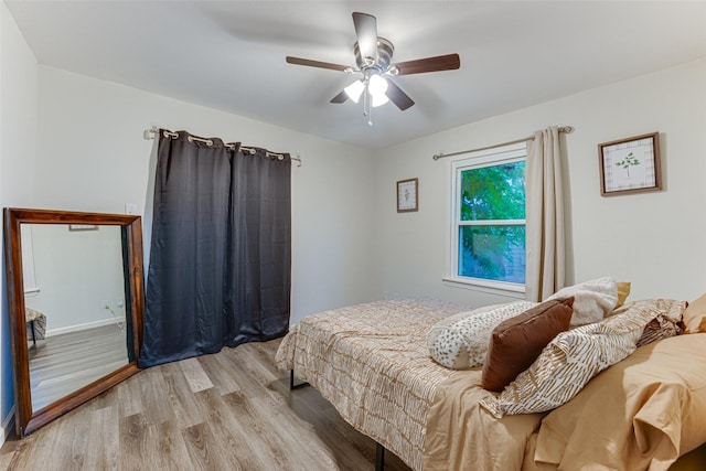 3444 Kellogg Ave, Dallas, TX 75216 - bedroom featuring wood finished floors, a ceiling fan, and baseboards