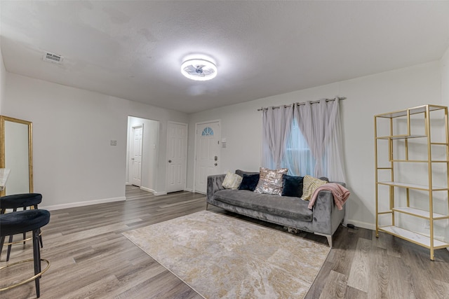 3444 Kellogg Ave, Dallas, TX 75216 - living room with wood finished floors and baseboards