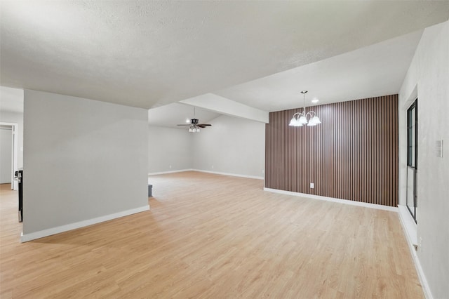 2833 Miller Pl, Mesquite, TX 75150 - unfurnished room featuring a chandelier, light wood finished floors, baseboards, and ceiling fan