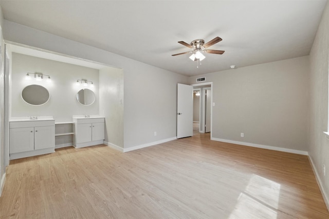 2833 Miller Pl, Mesquite, TX 75150 - unfurnished bedroom with light wood-style flooring, baseboards, ensuite bathroom, and a sink