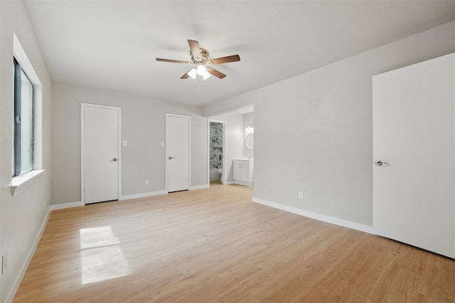 2833 Miller Pl, Mesquite, TX 75150 - unfurnished bedroom featuring light wood-style flooring, connected bathroom, and baseboards