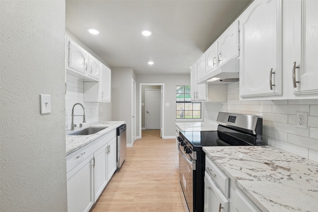 2833 Miller Pl, Mesquite, TX 75150 - kitchen with appliances with stainless steel finishes, a sink, under cabinet range hood, tasteful backsplash, and light stone counters