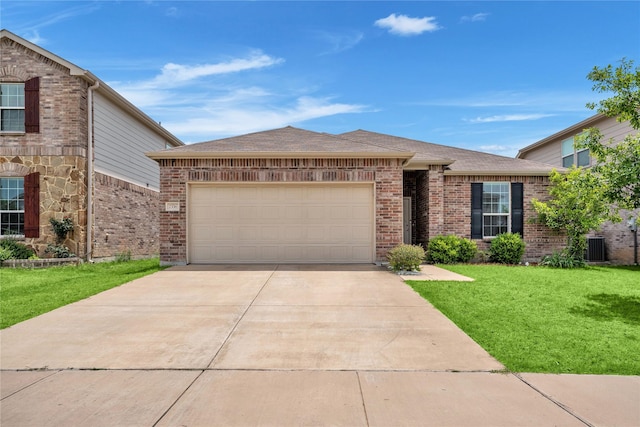 2336 Bermont Red Ln, Fort Worth, TX 76131 - view of front of home with driveway, a garage, a front yard, and brick siding