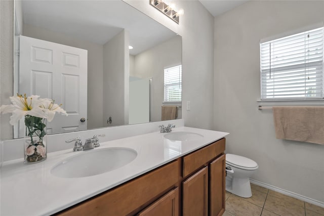 2336 Bermont Red Ln, Fort Worth, TX 76131 - bathroom featuring tile patterned flooring, toilet, double vanity, a shower, and baseboards