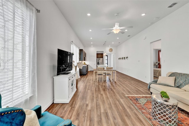 1413 Horizon Way, Northlake, TX 76247 - living room with healthy amount of natural light, light wood finished floors, a ceiling fan, baseboards, and recessed lighting
