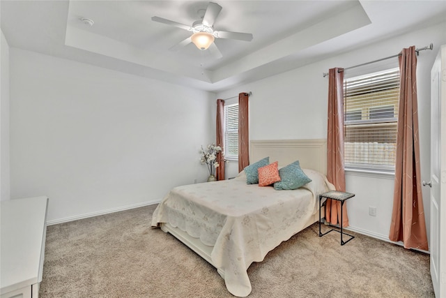 1413 Horizon Way, Northlake, TX 76247 - carpeted bedroom featuring a raised ceiling, baseboards, and ceiling fan