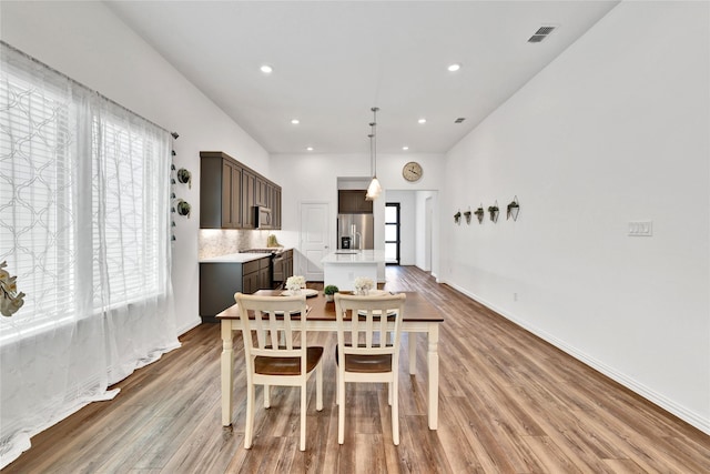 1413 Horizon Way, Northlake, TX 76247 - dining area with light wood-style floors, healthy amount of natural light, recessed lighting, and baseboards