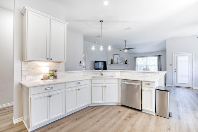 2836 Dawn Spring Dr, Little Elm, TX 75068 - kitchen featuring dishwasher, light wood-type flooring, white cabinets, tasteful backsplash, and light countertops
