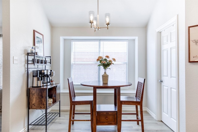 2836 Dawn Spring Dr, Little Elm, TX 75068 - dining room with light wood-style flooring, a chandelier, and baseboards