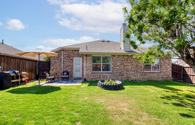 2836 Dawn Spring Dr, Little Elm, TX 75068 - rear view of property with a patio area, brick siding, a chimney, and roof with shingles
