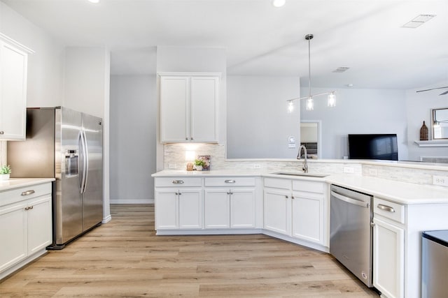 2836 Dawn Spring Dr, Little Elm, TX 75068 - kitchen featuring a sink, stainless steel appliances, light countertops, and recessed lighting