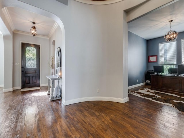 114 Crestbrook Dr, Rockwall, TX 75087 - entrance foyer featuring arched walkways, healthy amount of natural light, wood finished floors, and ornamental molding