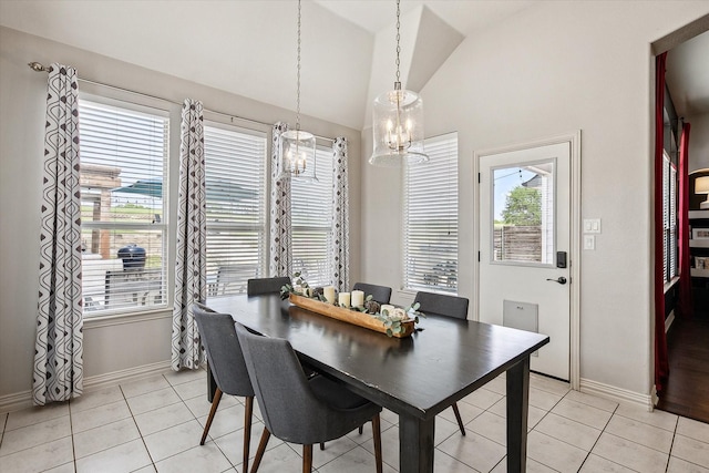 10601 Los Rios Dr, Fort Worth, TX 76179 - dining area with a chandelier, lofted ceiling, baseboards, and light tile patterned floors