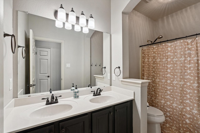 10601 Los Rios Dr, Fort Worth, TX 76179 - bathroom with toilet, double vanity, and curtained shower