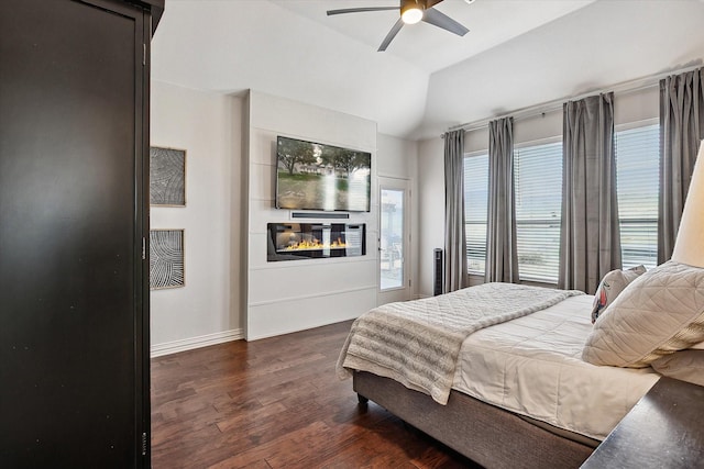 10601 Los Rios Dr, Fort Worth, TX 76179 - bedroom featuring a fireplace, dark wood finished floors, lofted ceiling, ceiling fan, and baseboards