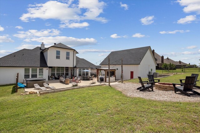 10601 Los Rios Dr, Fort Worth, TX 76179 - back of property with a hot tub, an outdoor fire pit, a patio, a lawn, and a chimney