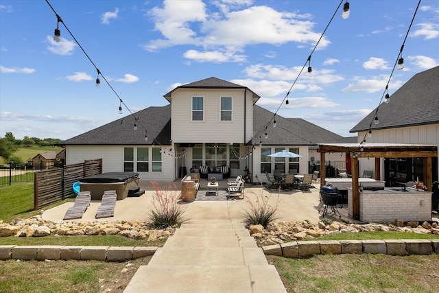 10601 Los Rios Dr, Fort Worth, TX 76179 - rear view of house with a hot tub, a fenced backyard, a patio area, and roof with shingles