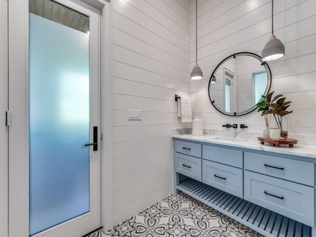 620 Redwood Creek Dr, Fairview, TX 75069 - bathroom with vanity, tile patterned flooring, and wood walls