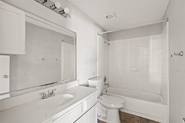 full bath with vanity, shower / bath combination, toilet, and a textured ceiling