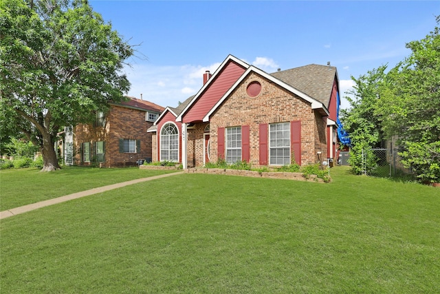 view of front of property featuring brick siding and a chimney