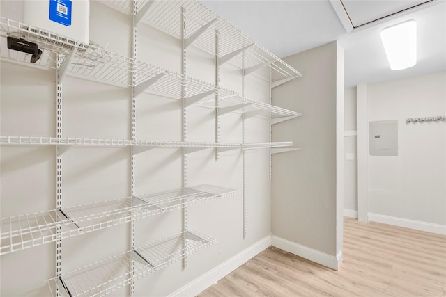 9031 Fringewood Dr, Dallas, TX 75228 - spacious closet with electric panel and wood finished floors