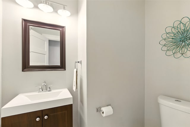 9031 Fringewood Dr, Dallas, TX 75228 - half bath featuring toilet and vanity