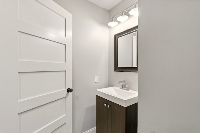 9031 Fringewood Dr, Dallas, TX 75228 - bathroom with vanity and baseboards