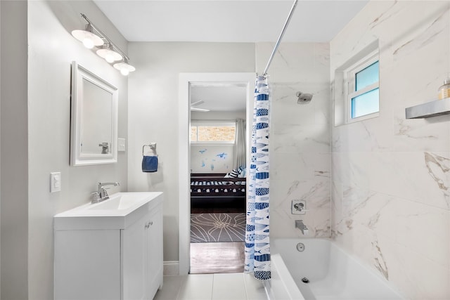 9031 Fringewood Dr, Dallas, TX 75228 - bathroom featuring vanity, shower / bath combo with shower curtain, healthy amount of natural light, and tile patterned floors