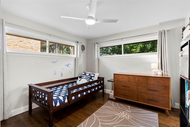 9031 Fringewood Dr, Dallas, TX 75228 - bedroom with dark wood-type flooring, ceiling fan, and baseboards