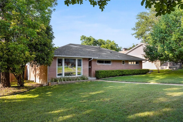 9031 Fringewood Dr, Dallas, TX 75228 - ranch-style house with a front lawn and brick siding