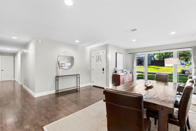 9031 Fringewood Dr, Dallas, TX 75228 - dining room with wood finished floors, baseboards, and recessed lighting
