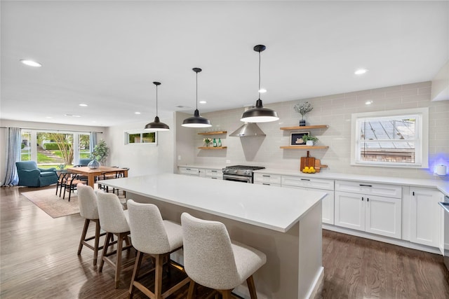 9031 Fringewood Dr, Dallas, TX 75228 - kitchen with open shelves, stainless steel range with gas cooktop, backsplash, white cabinetry, and light countertops