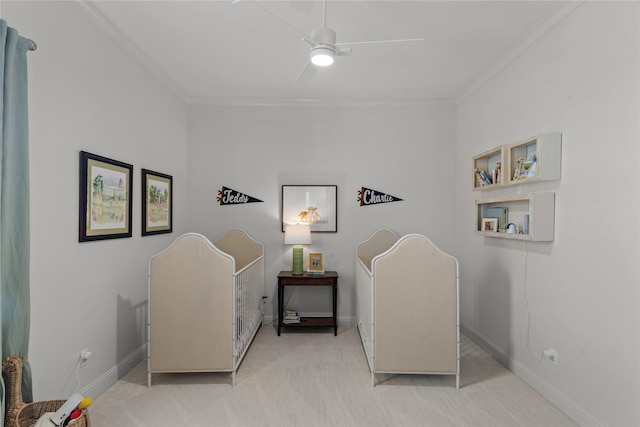 living area featuring ornamental molding, ceiling fan, carpet floors, and baseboards