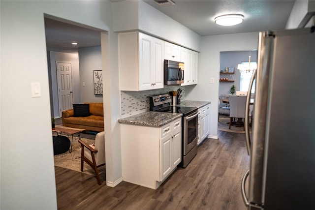 710 Melrose Dr, Richardson, TX 75080 - kitchen featuring stainless steel appliances, dark wood-style floors, white cabinetry, backsplash, and stone countertops