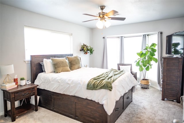 710 Melrose Dr, Richardson, TX 75080 - bedroom with light colored carpet, multiple windows, a ceiling fan, and baseboards
