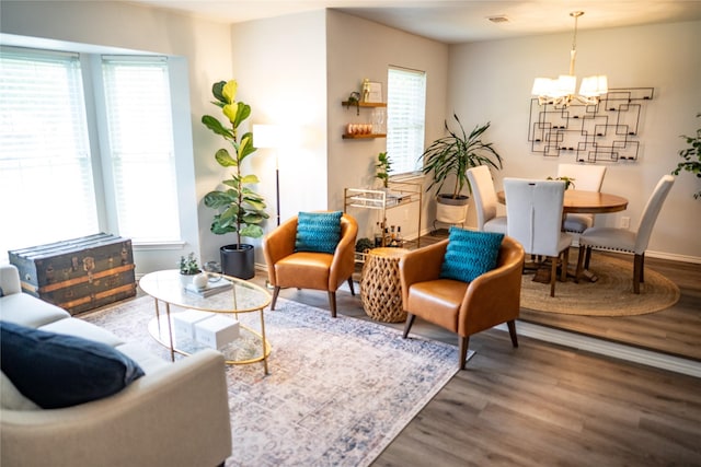 710 Melrose Dr, Richardson, TX 75080 - living area featuring a chandelier, wood finished floors, and baseboards